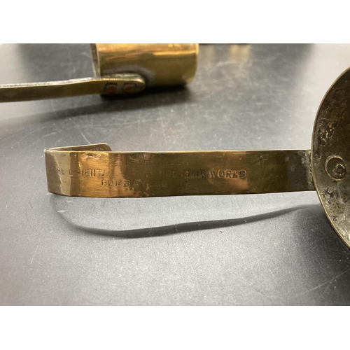 238 - A set of four vintage brass graduating measuring cups, two stamped 'The Oriental Metal Dressing Work... 