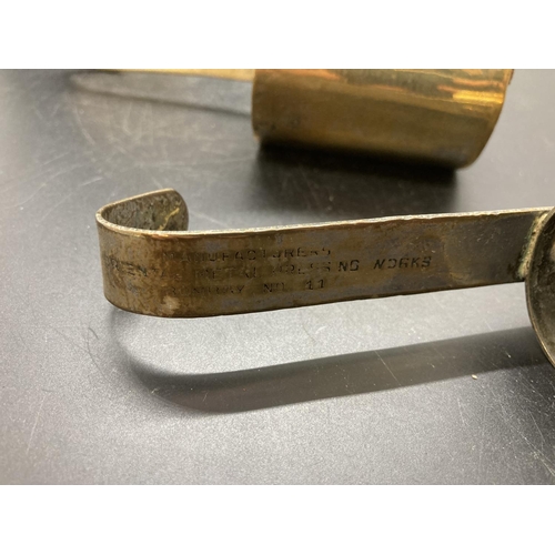 238 - A set of four vintage brass graduating measuring cups, two stamped 'The Oriental Metal Dressing Work... 