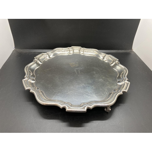 1 - A hallmarked Sheffield silver salver with scalloped edge and tri-footed base by Gladwin Ltd, dated 1... 