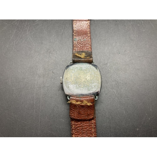 63 - A vintage Tempex Swiss made wristwatch with brown leather strap