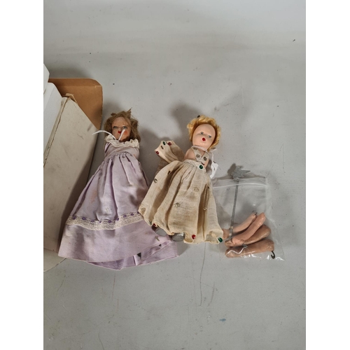 475 - Four items to include two vintage articulated painted dolls, set of wooden French skittles and a pew... 