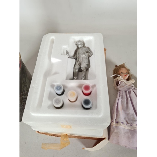 475 - Four items to include two vintage articulated painted dolls, set of wooden French skittles and a pew... 