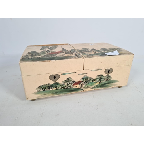 337 - A vintage hand painted two division musical jewellery box