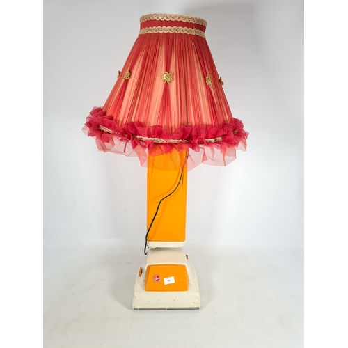 367 - A vintage Hoover orange and white vacuum cleaner converted lamp with red shade