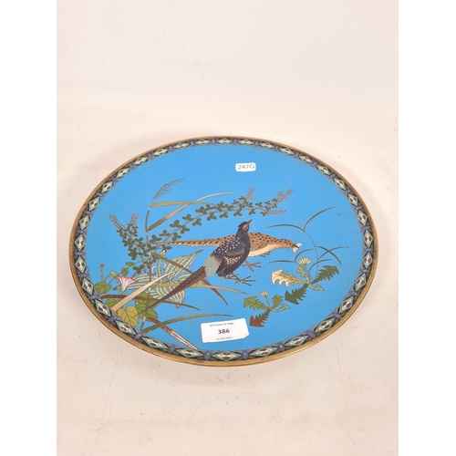 386 - A cloisonné wall charger with stylized bird design - approx. 31cm diameter