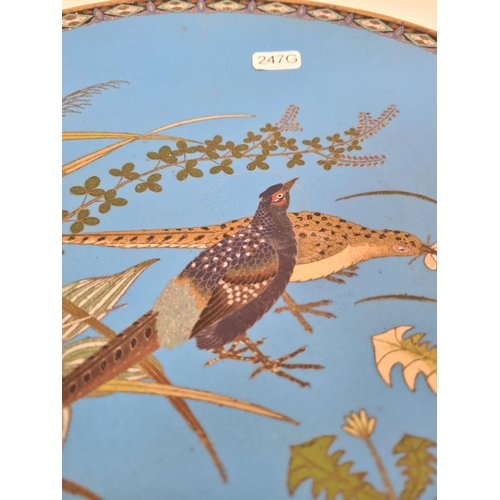 386 - A cloisonné wall charger with stylized bird design - approx. 31cm diameter