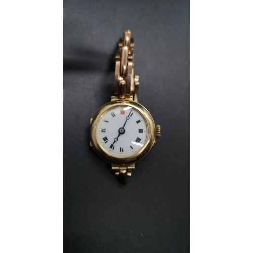 58 - A vintage hallmarked 15ct yellow gold wristwatch with 9ct rose gold strap - approx. gross weight wit... 