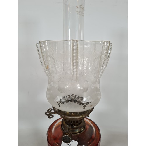 361 - A Hinks no. 2 brass oil lamp with red glass reservoir and etched glass shade - approx. 48cm high