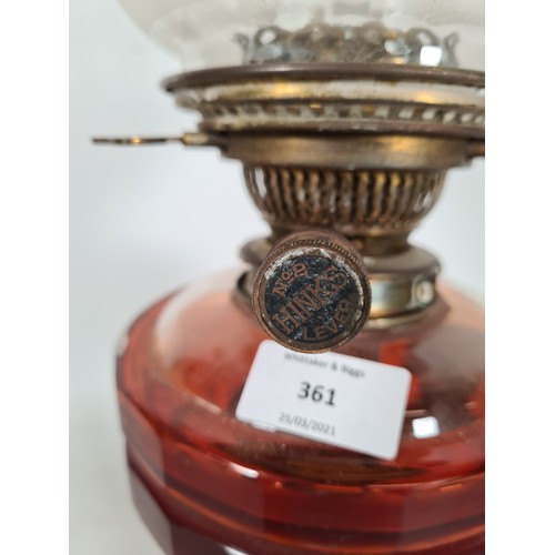 361 - A Hinks no. 2 brass oil lamp with red glass reservoir and etched glass shade - approx. 48cm high