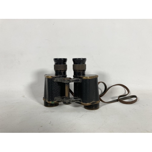 59A - A pair of Taylor Hobson military issue binoculars dated 1941