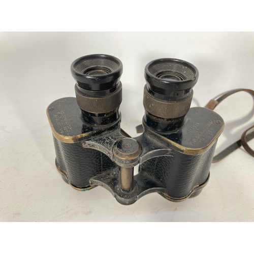 59A - A pair of Taylor Hobson military issue binoculars dated 1941