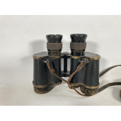 59A - A pair of Taylor Hobson military issue binoculars dated 1941