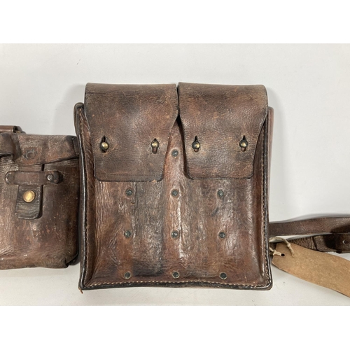 65 - Two leather ammo pouches