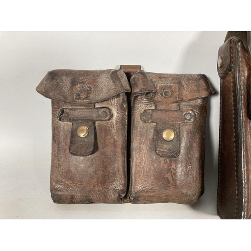 65 - Two leather ammo pouches