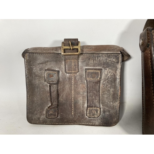 65 - Two leather ammo pouches