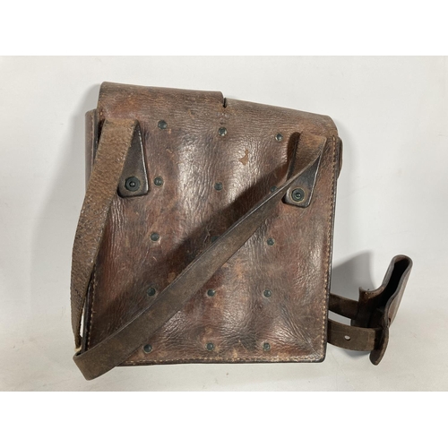 65 - Two leather ammo pouches