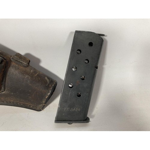 67 - A WWII Browning pistol holster with magazine and cleaning rod