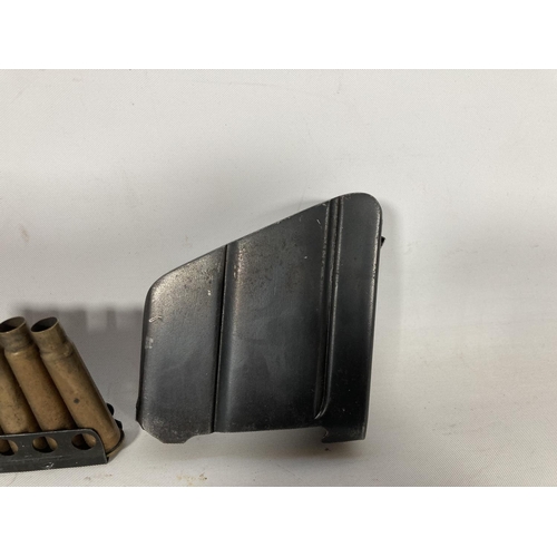 72 - Three 303 rifle clips with magazine