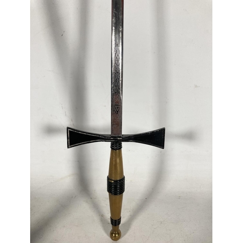 79 - An early masonic sword with black leather and brass sheath and etched blade - blade approx. 69.5cm l... 