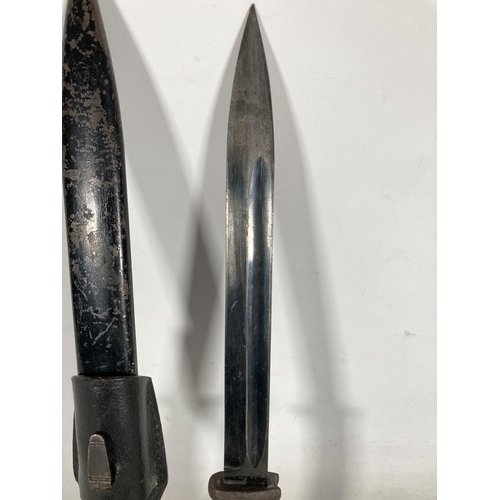 81 - A WWII German K98 bayonet and frog - blade approx. 25cm long