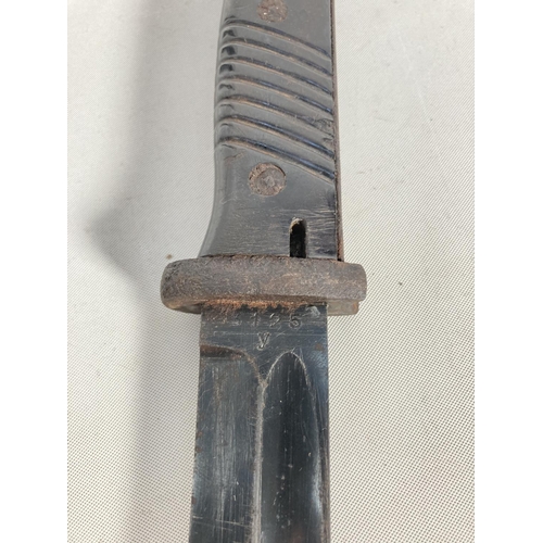 81 - A WWII German K98 bayonet and frog - blade approx. 25cm long