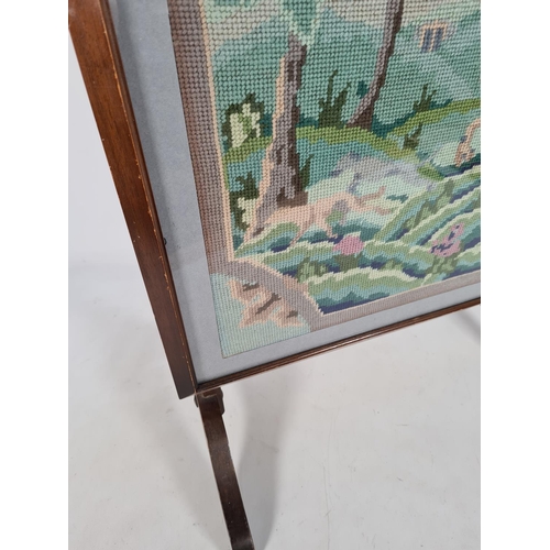 157 - A vintage mahogany framed metamorphic fire screen with tapestry insert and glass front