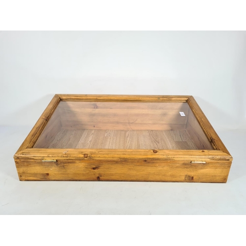 163 - A pine countertop display cabinet - approx. 23cm high x 79.5cm wide x 48cm deep