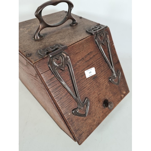 165 - An Art Nouveau oak coal box with copper handle and fittings