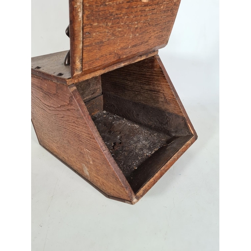 165 - An Art Nouveau oak coal box with copper handle and fittings