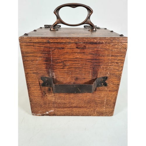 165 - An Art Nouveau oak coal box with copper handle and fittings