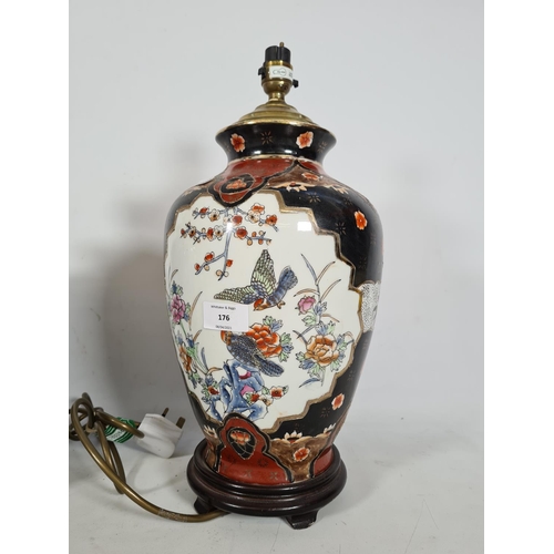 176 - Two ceramic table lamps, one hand painted oriental style with bird design - approx. 44cm high and on... 