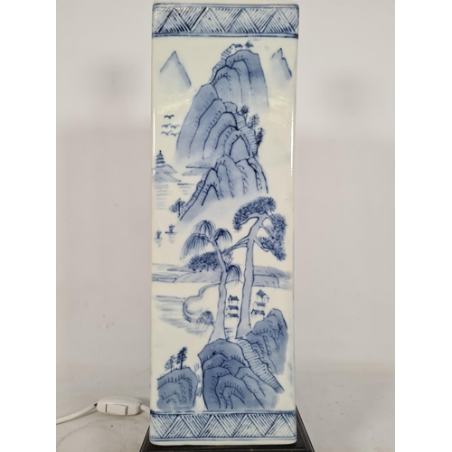 179 - An oriental style blue and white ceramic table lamp with landscape and garden design - approx. 52cm ... 