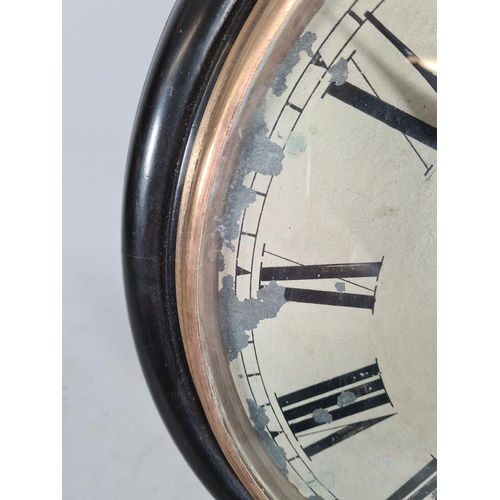 194 - A 19th century ebonised single fusee wall clock with white painted face, Roman numerals, brass bezel... 