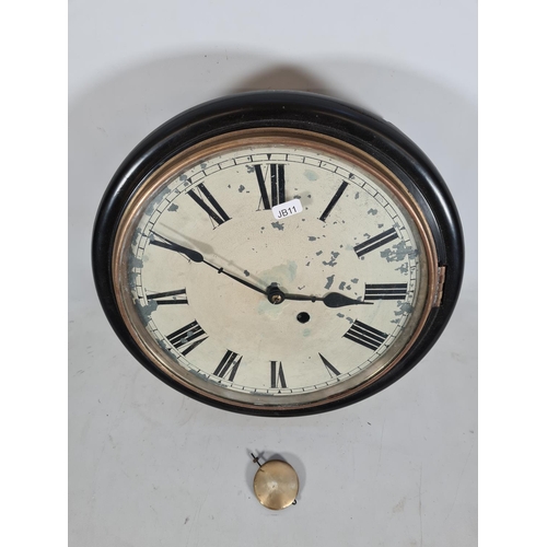 194 - A 19th century ebonised single fusee wall clock with white painted face, Roman numerals, brass bezel... 