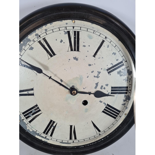 194 - A 19th century ebonised single fusee wall clock with white painted face, Roman numerals, brass bezel... 