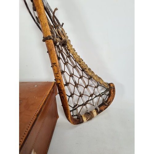 198 - Three items, two vintage lacrosse sticks and one tanned leather briefcase