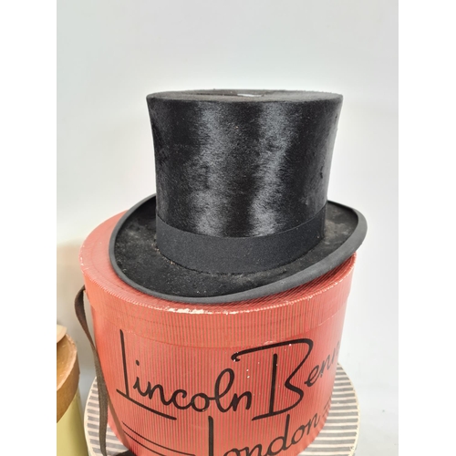 210 - A collection of vintage hats to include one Lincoln Bennett & Co of London top hat, Christies of Lon... 