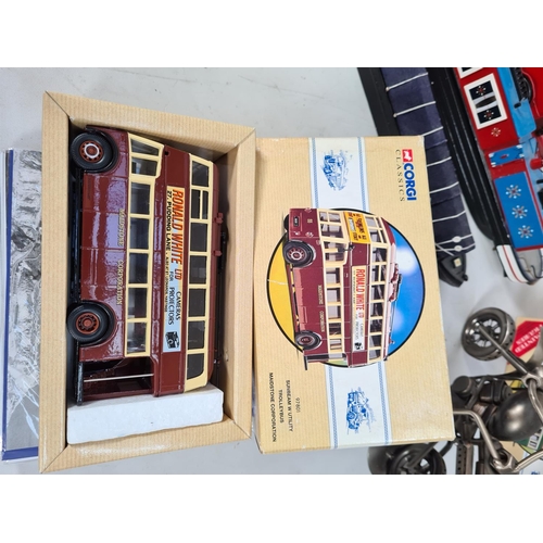 217 - Various items to include two handmade and painted narrow boats, one vintage style London double deck... 