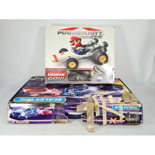 218 - Two items, one boxed Carrera Go Mario Kart DS slot car set and one box of Scalextric Le Mans advance... 