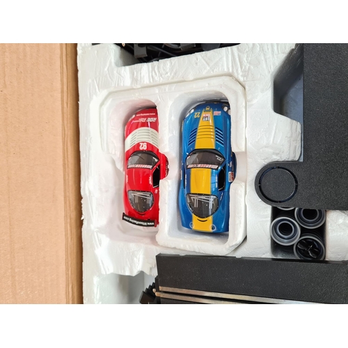 218 - Two items, one boxed Carrera Go Mario Kart DS slot car set and one box of Scalextric Le Mans advance... 