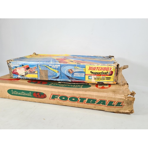 219 - Two items, one boxed Matchbox Superfast Track.600 double booster racing circuit and one boxed Munro ... 