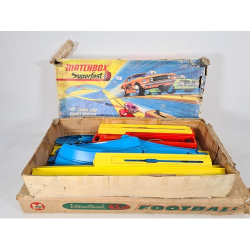 219 - Two items, one boxed Matchbox Superfast Track.600 double booster racing circuit and one boxed Munro ... 