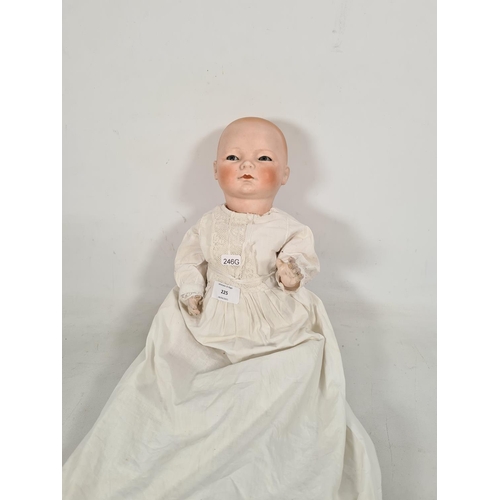 225 - An early 20th century German Schoenau & Hoffmeister bisque headed articulated doll with impressed ma... 