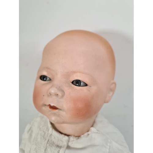 225 - An early 20th century German Schoenau & Hoffmeister bisque headed articulated doll with impressed ma... 