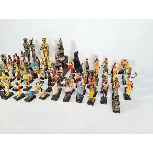 229 - A box containing a collection of hand painted Egyptian figurines