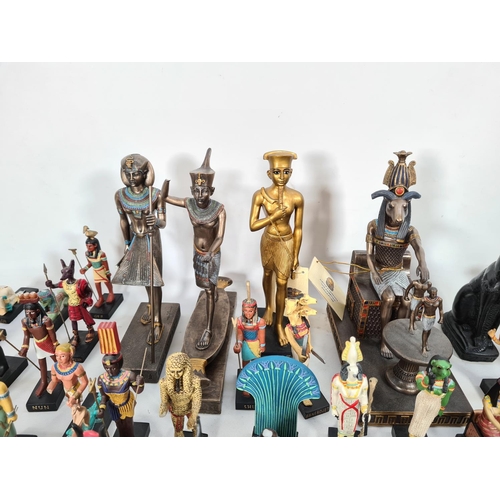 229 - A box containing a collection of hand painted Egyptian figurines