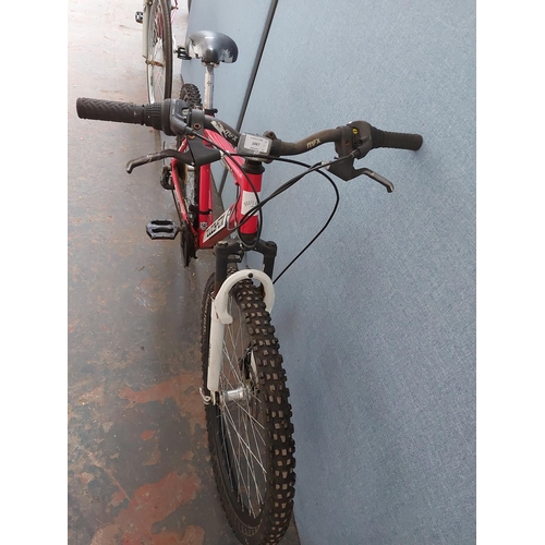 Two bikes one red Muddyfox Rebel gent s mountain bike with quick release front wheel front disc br