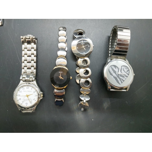 128 - A collection of various modern ladies and gents wrist watches to include boxed Storm of London steel... 