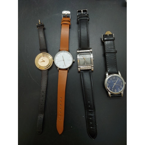 128 - A collection of various modern ladies and gents wrist watches to include boxed Storm of London steel... 