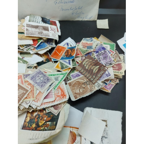 135 - A collection of loose worldwide stamps